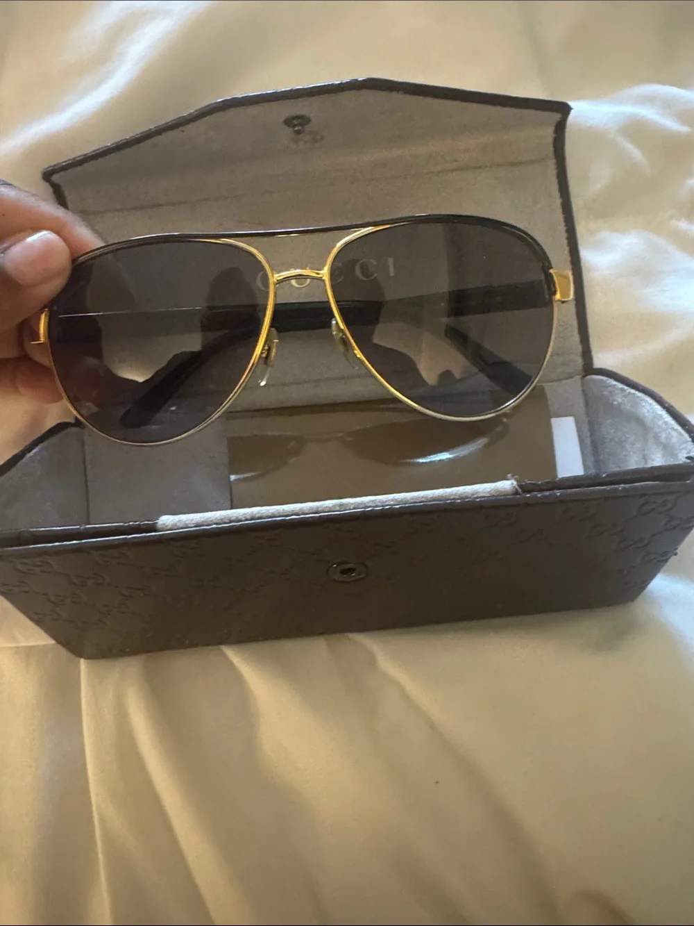 Gucci Black Frame Sunglasses with Gold Brow Bar